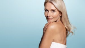 Beautiful woman smiles after a nonsurgical facelift with Attiva IRF